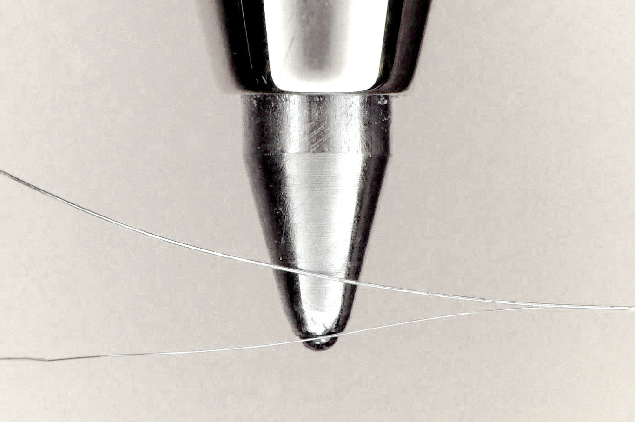 GORE INNOVATION LABS Fine Wire size compared to the tip of a pen
